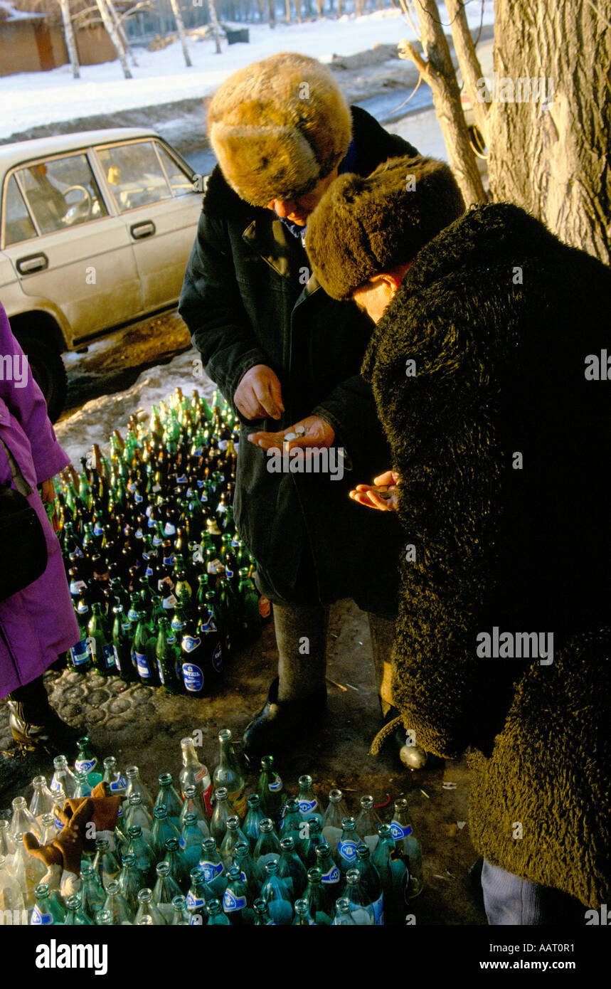 LADA COLLECTING CASH FOR EMPTY GLASS BOTTLES IN TOGLIATTI CITY RUSSIA  Stock Photo