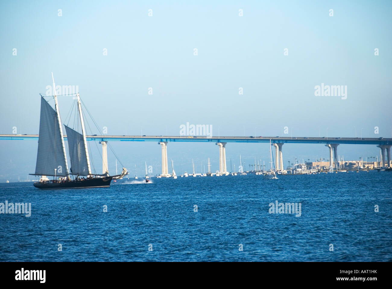 Coronado Bridge with a black sail boat in San Diego, California Stock Photo