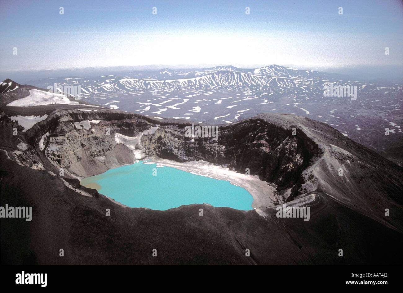 Mali Semyachik Volcanic crater filled with turquoise acidic lake in Kamchatcka Stock Photo