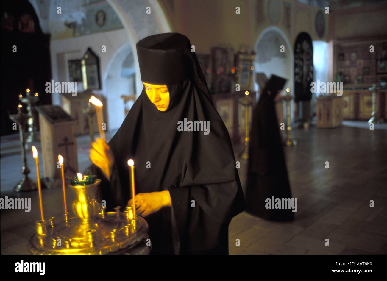 Nun candle hi-res stock photography and images - Alamy