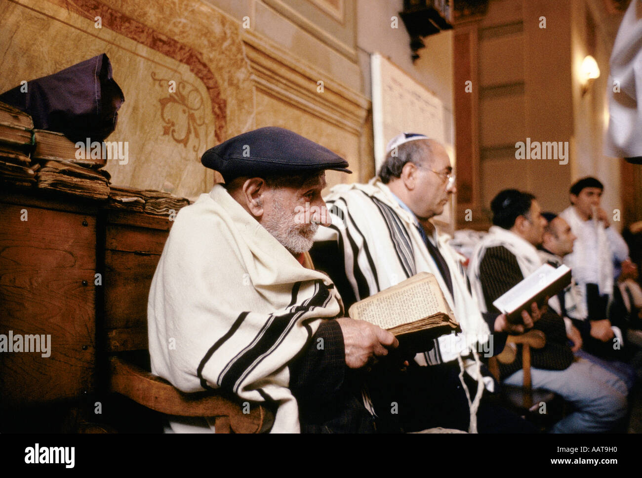 Jewish men worshipping in a synagogue Stock Photo