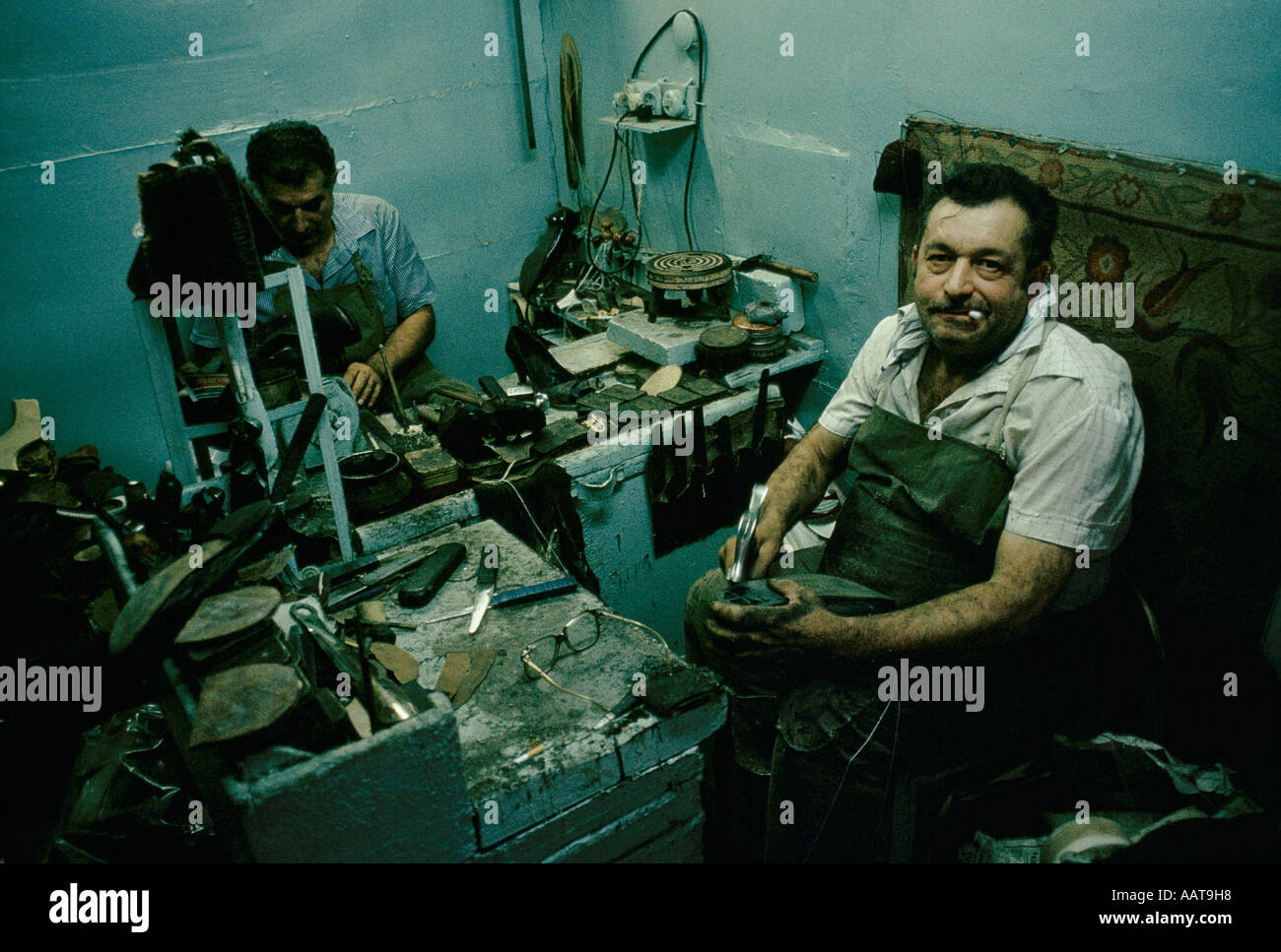 A cobbler repairing shoes in Georgia Stock Photo - Alamy