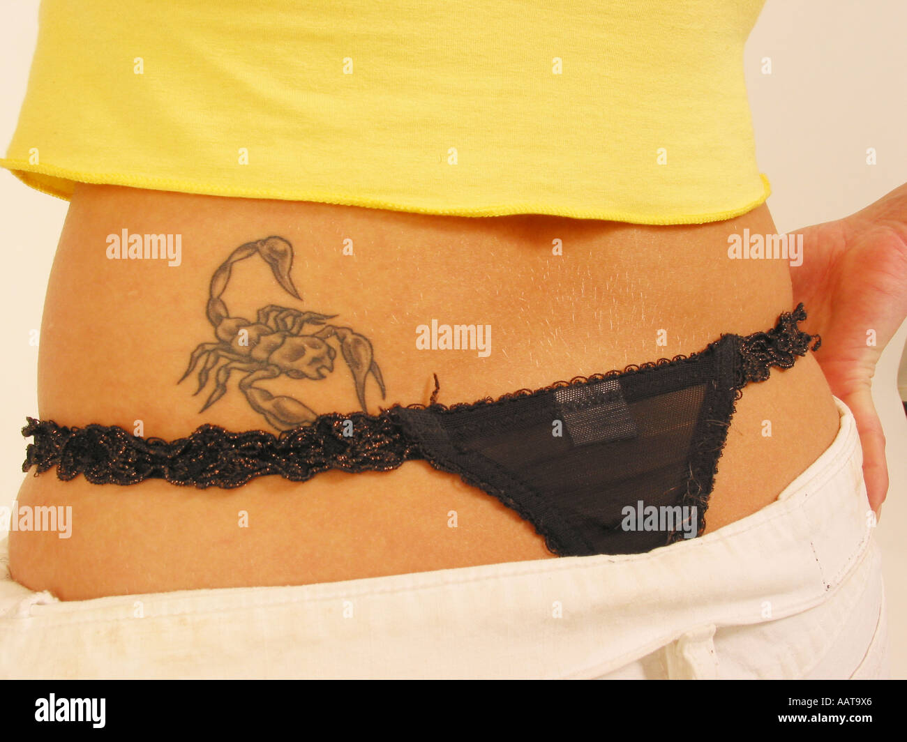 contemporary close up portrait of scorpion tattoo on lady's lower back  Stock Photo - Alamy
