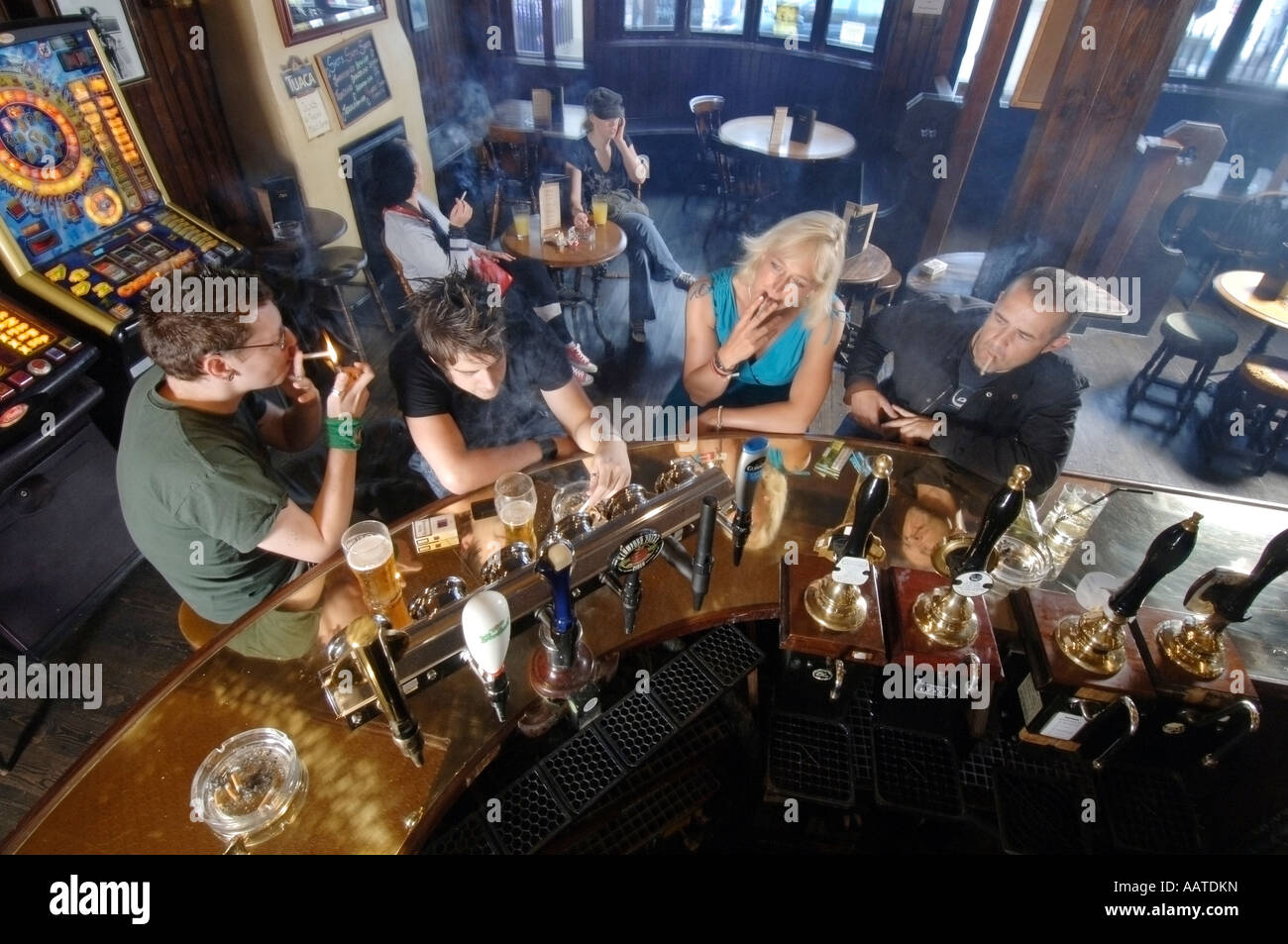 Drinkers and locals at The Pull and Pump public house in Brighton enjoy the last day of legal smoking in pubs in England Stock Photo