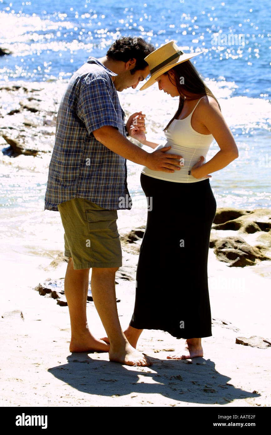 Man and woman embrace on beach Stock Photo - Alamy