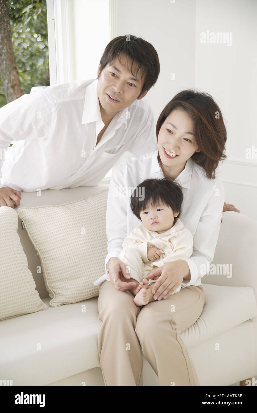 Baby girl on sofa hi-res stock photography and images - Alamy