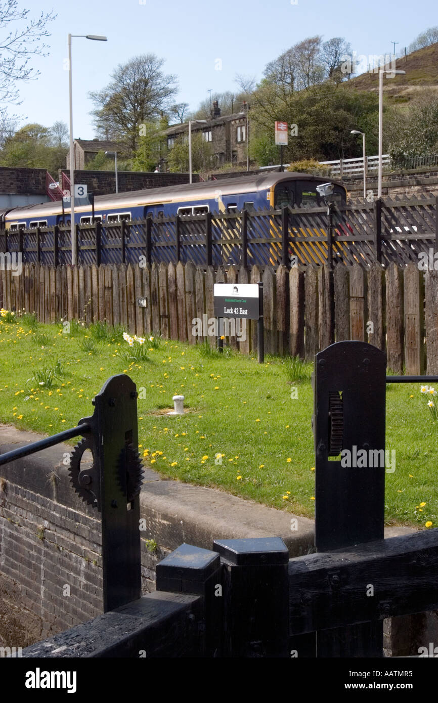 Lock on Huddersfield Narrow Canal beside railway at Marsden Stock Photo Alamy
