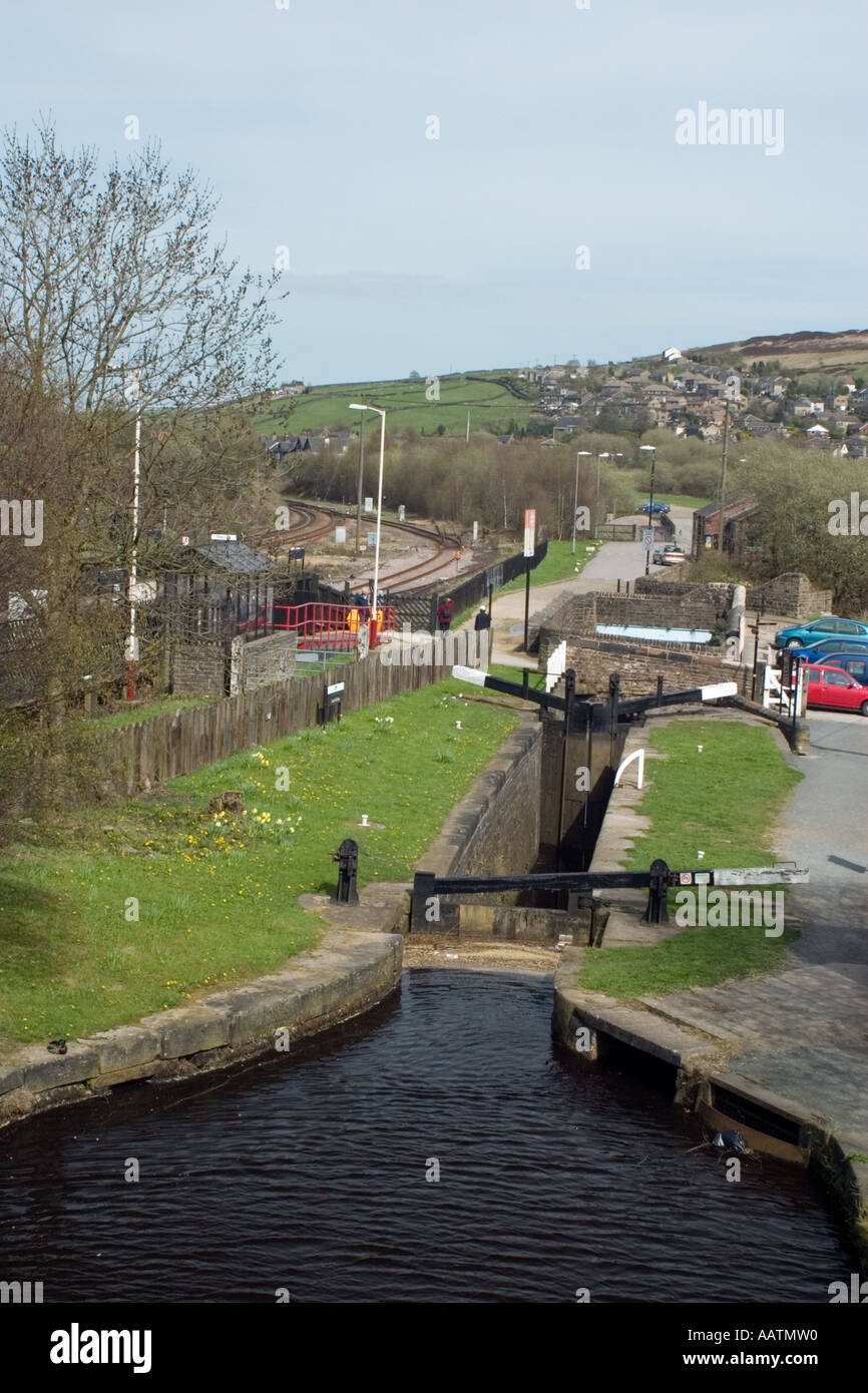 Lock on Huddersfield Narrow canal beside railway station at Marsden Stock Photo Alamy