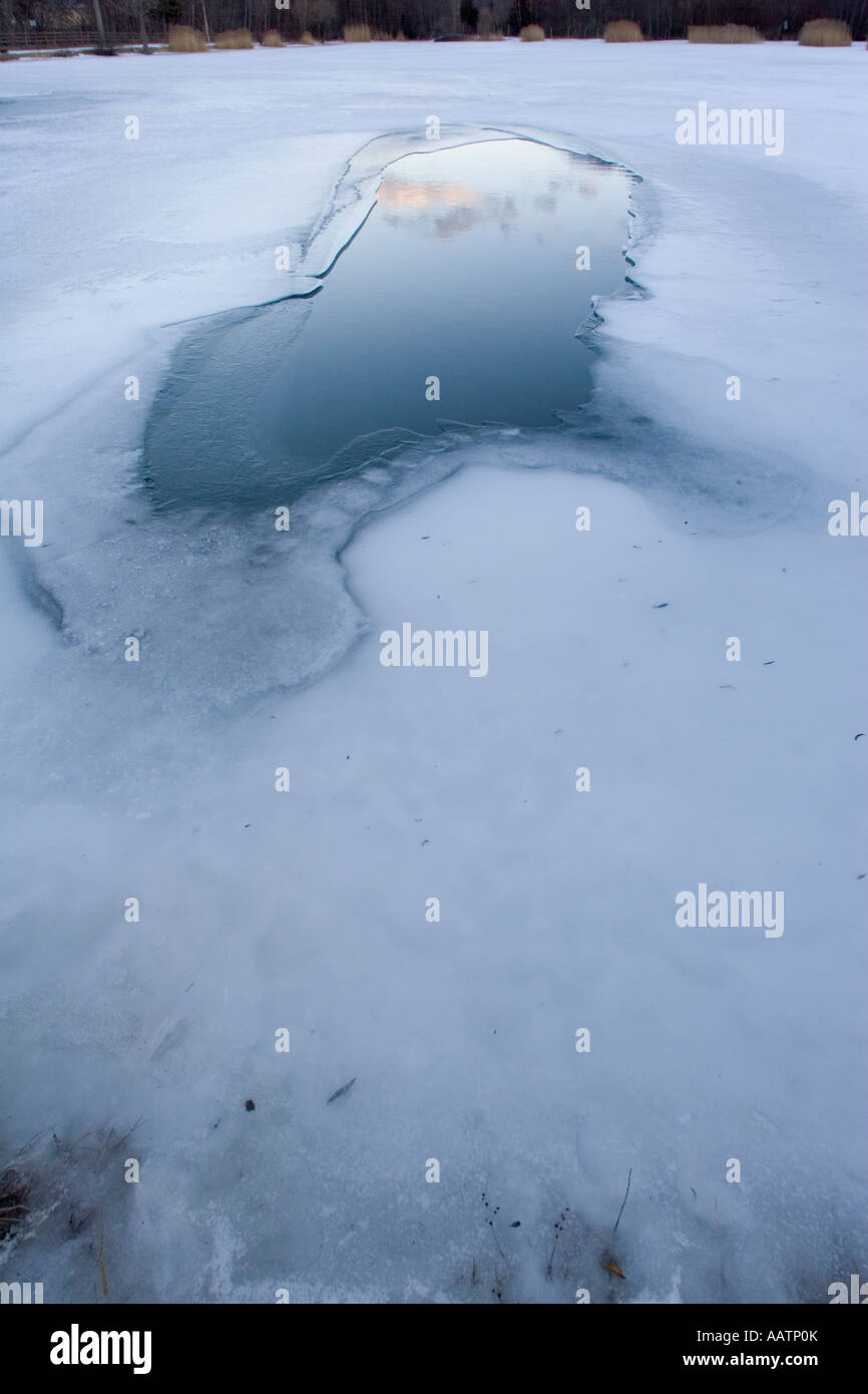 Frozen fishing lake, Spondigna (Spondinig), Alto Adige, Italy, Europe