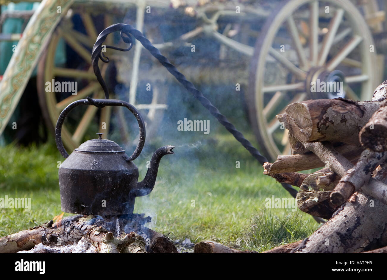 Gypsy caravan camp fire with water kettle. Stow-on-the-Wold, Cotswolds, Gloucestershire, England Stock Photo