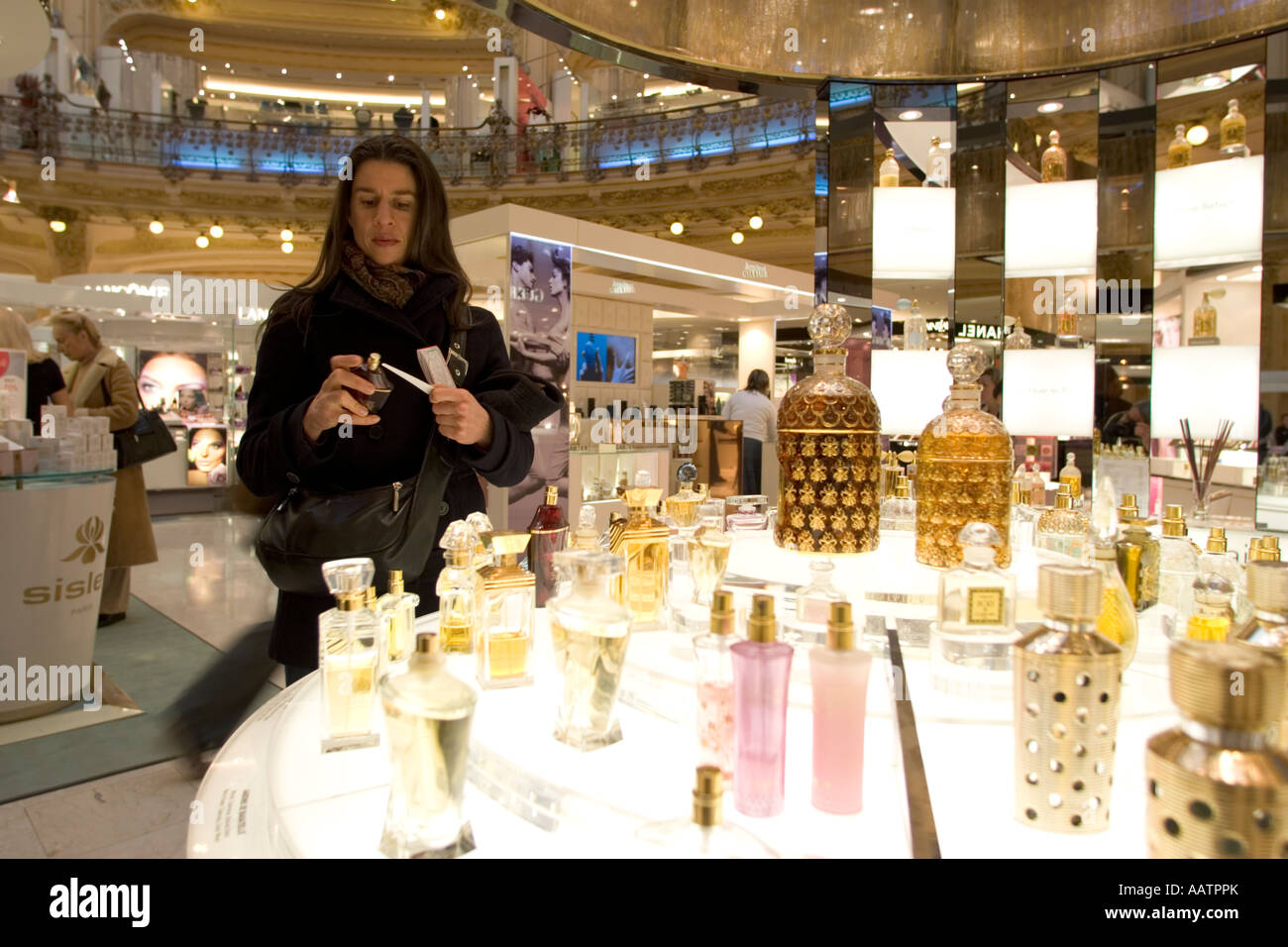 Shopping for perfume in Galeries Lafayette, Paris France Stock Photo