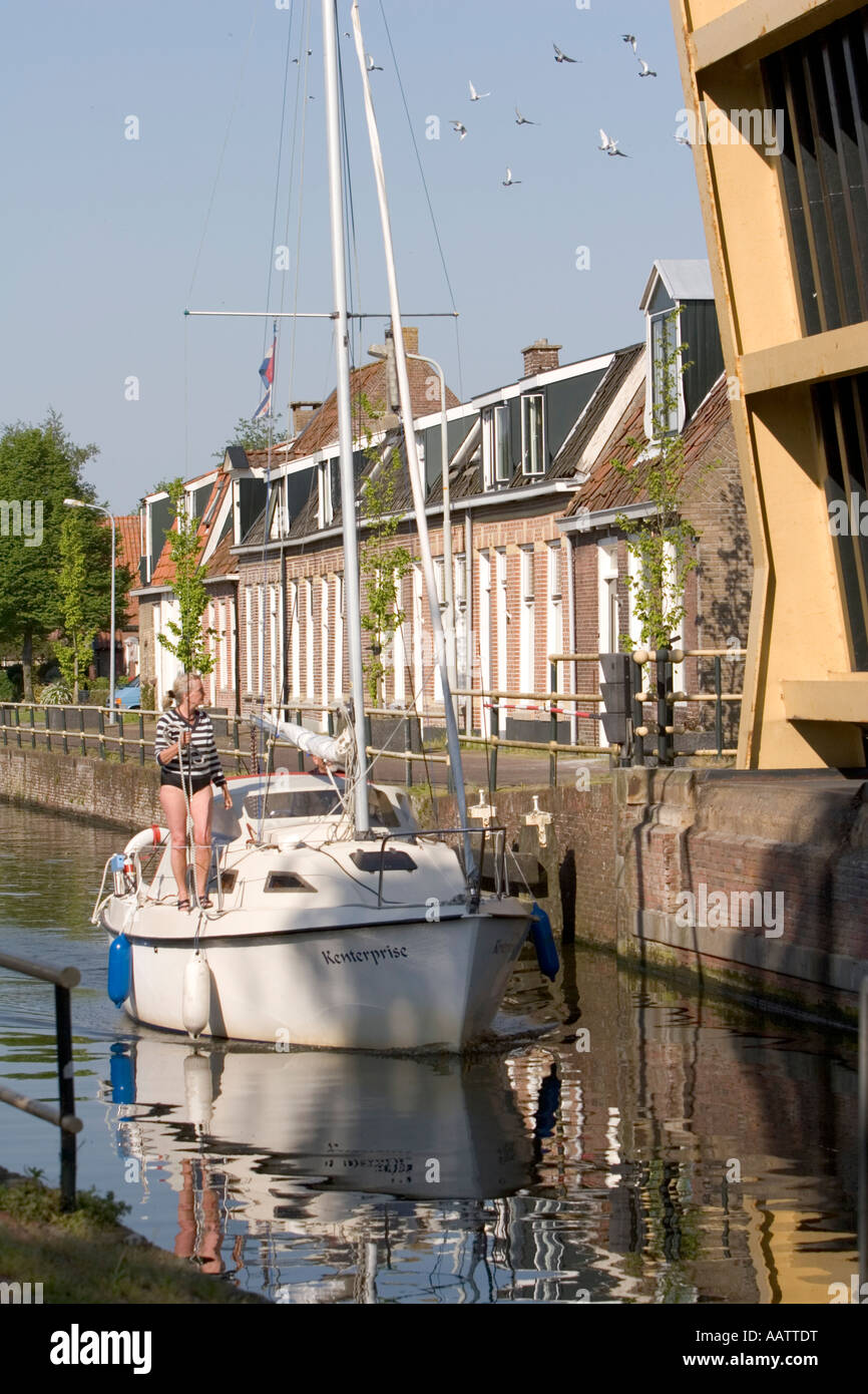Boating on the canal in the Frisian town of Workum, Netherland, Europe Stock Photo