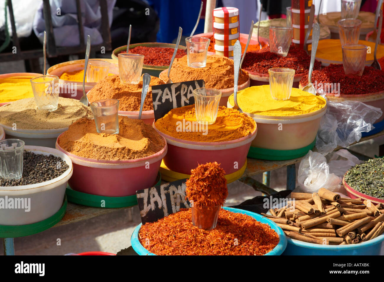 a selection of various spices including saffron on a spice stall for sale at the market in
