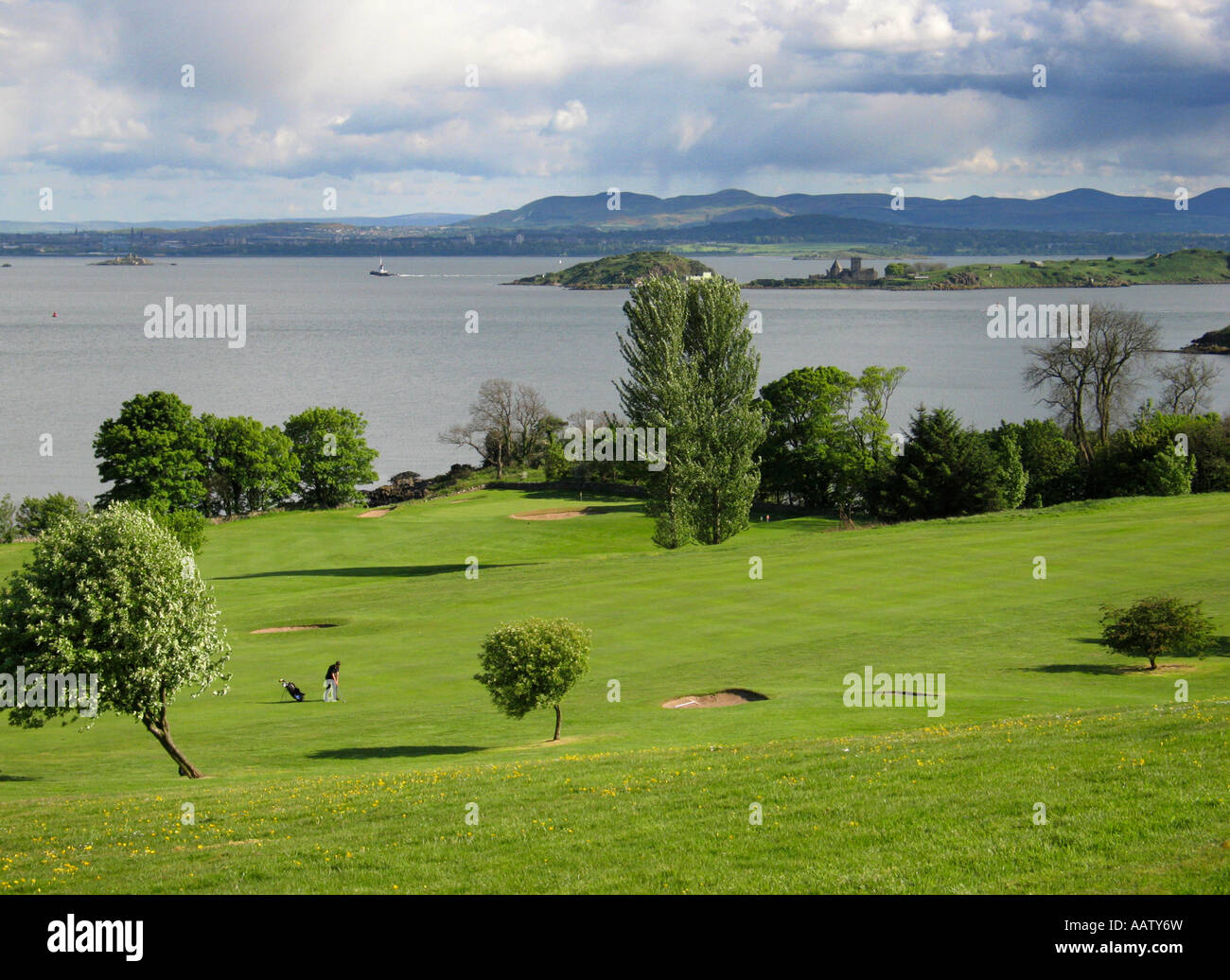 Looking across Aberdour golf course to Inchcolm Island in the Firth of Forth Stock Photo