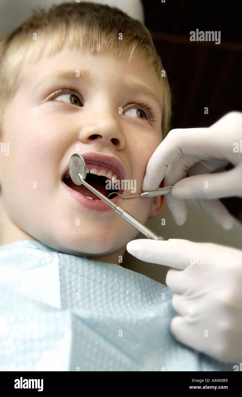 Boy getting dental exam Stock Photo Alamy