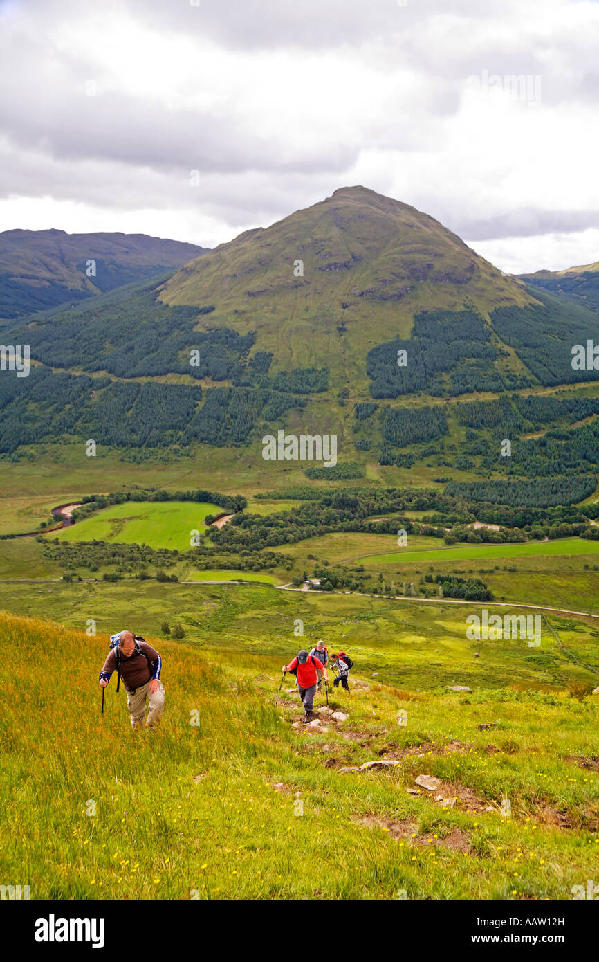 Walkers beginning the climb to Stob Binnein Stobinian from Inverlochlarig near Balquhidder Stock Photo