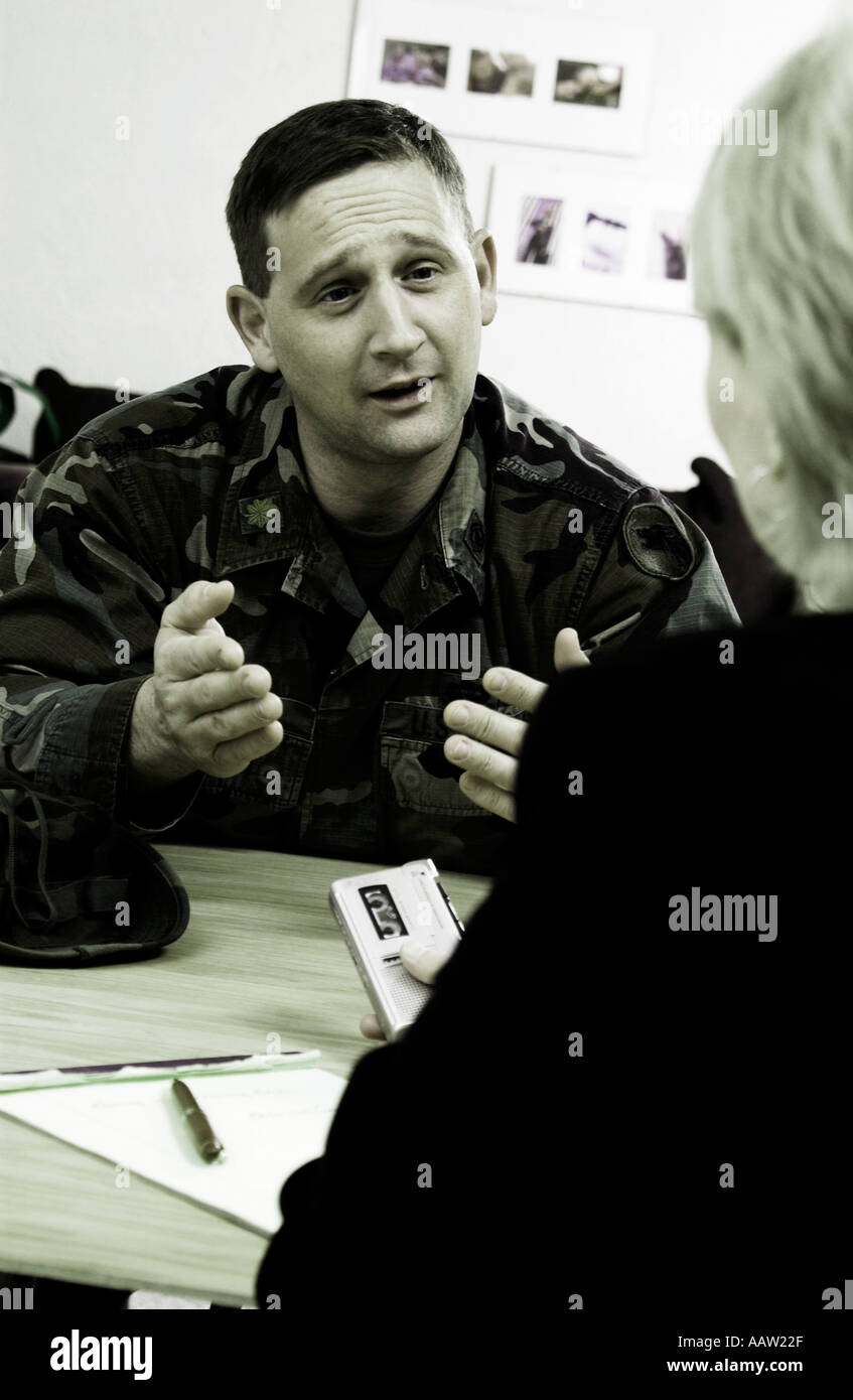 Reporter interviewing soldier Stock Photo - Alamy