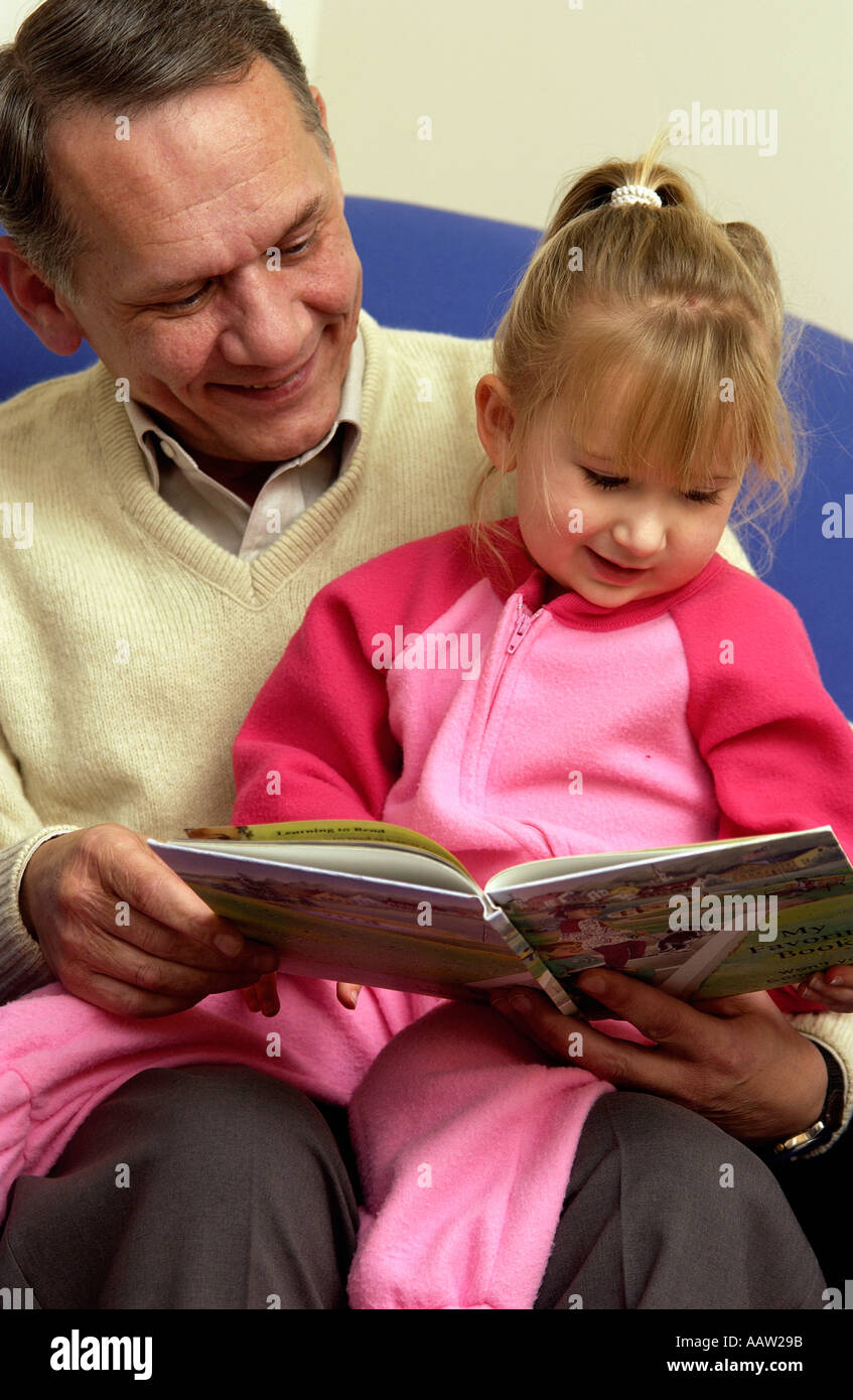 Grandparent reading bedtime story hires stock photography and images