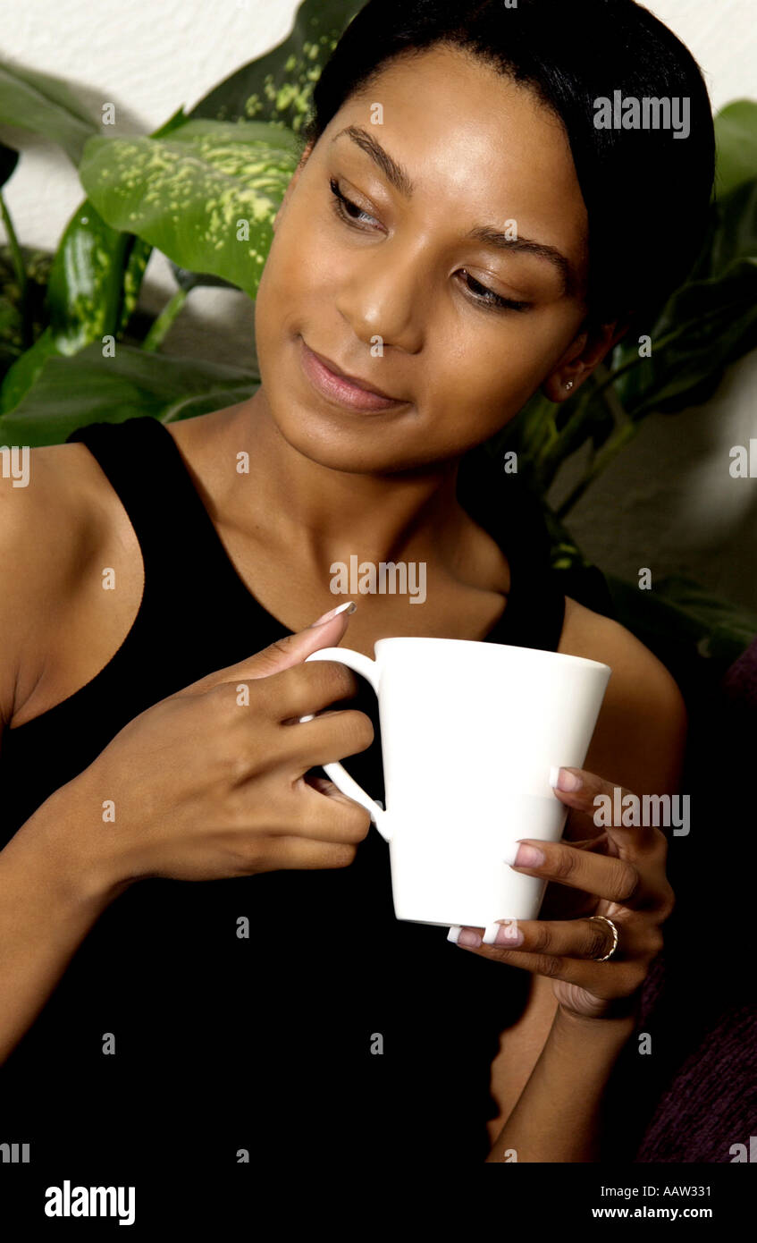 African American woman drinking coffee Stock Photo - Alamy