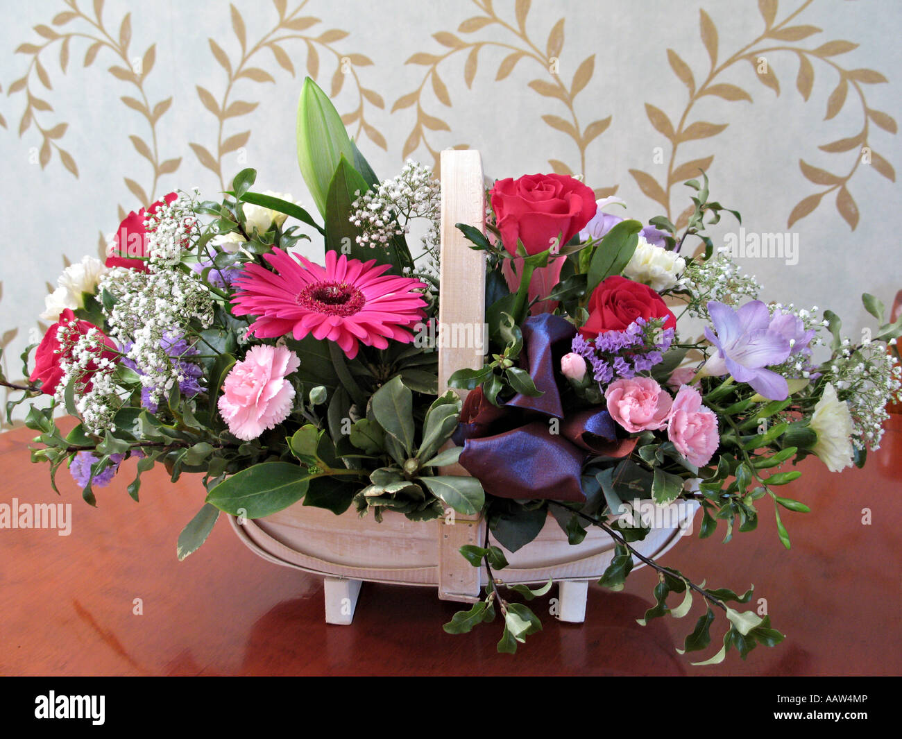 Flower arrangement of roses carnations and freesias Stock Photo Alamy
