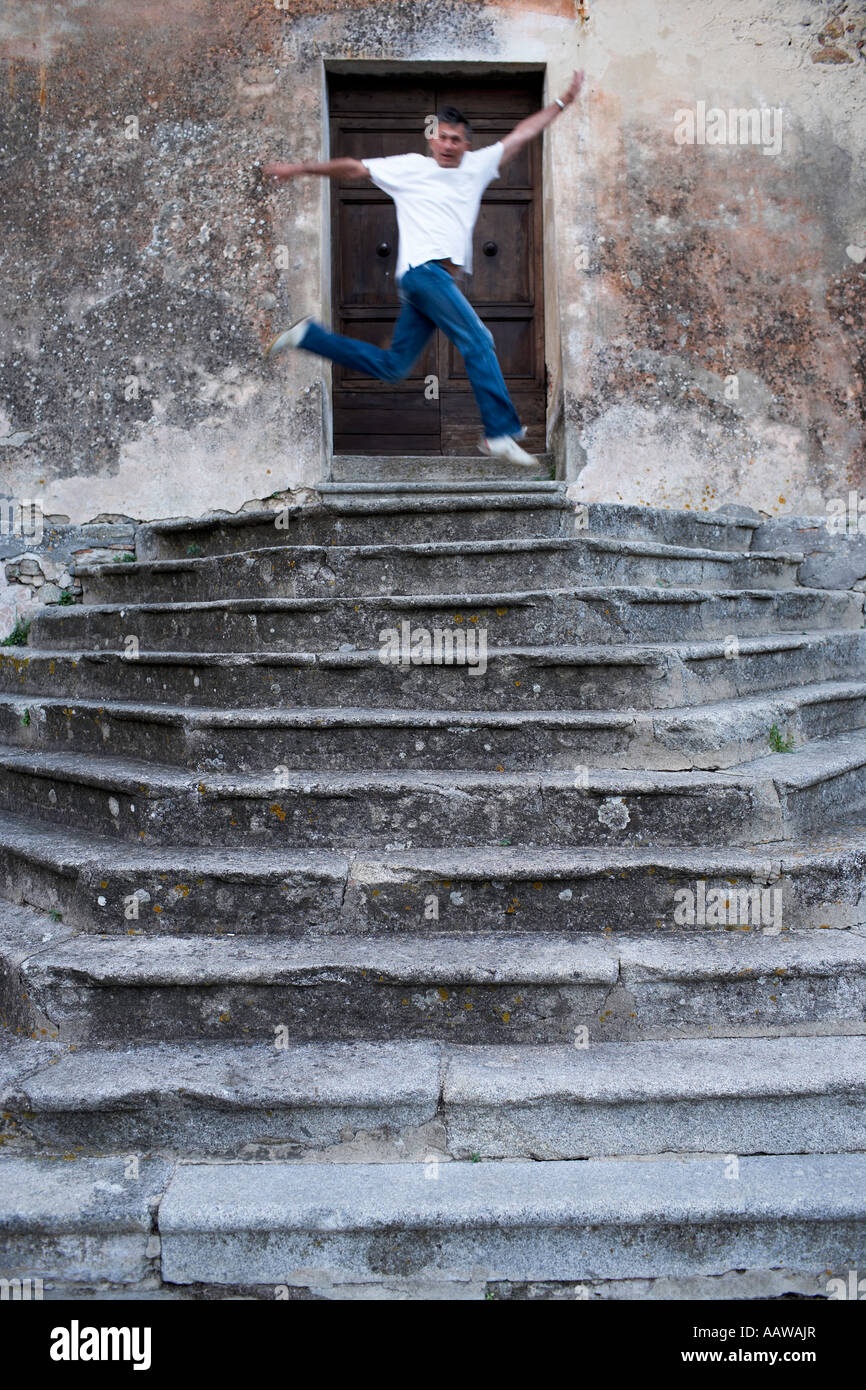 Tourist goofing off in front of curch steps and entrance in Poggio Elba Italy Stock Photo