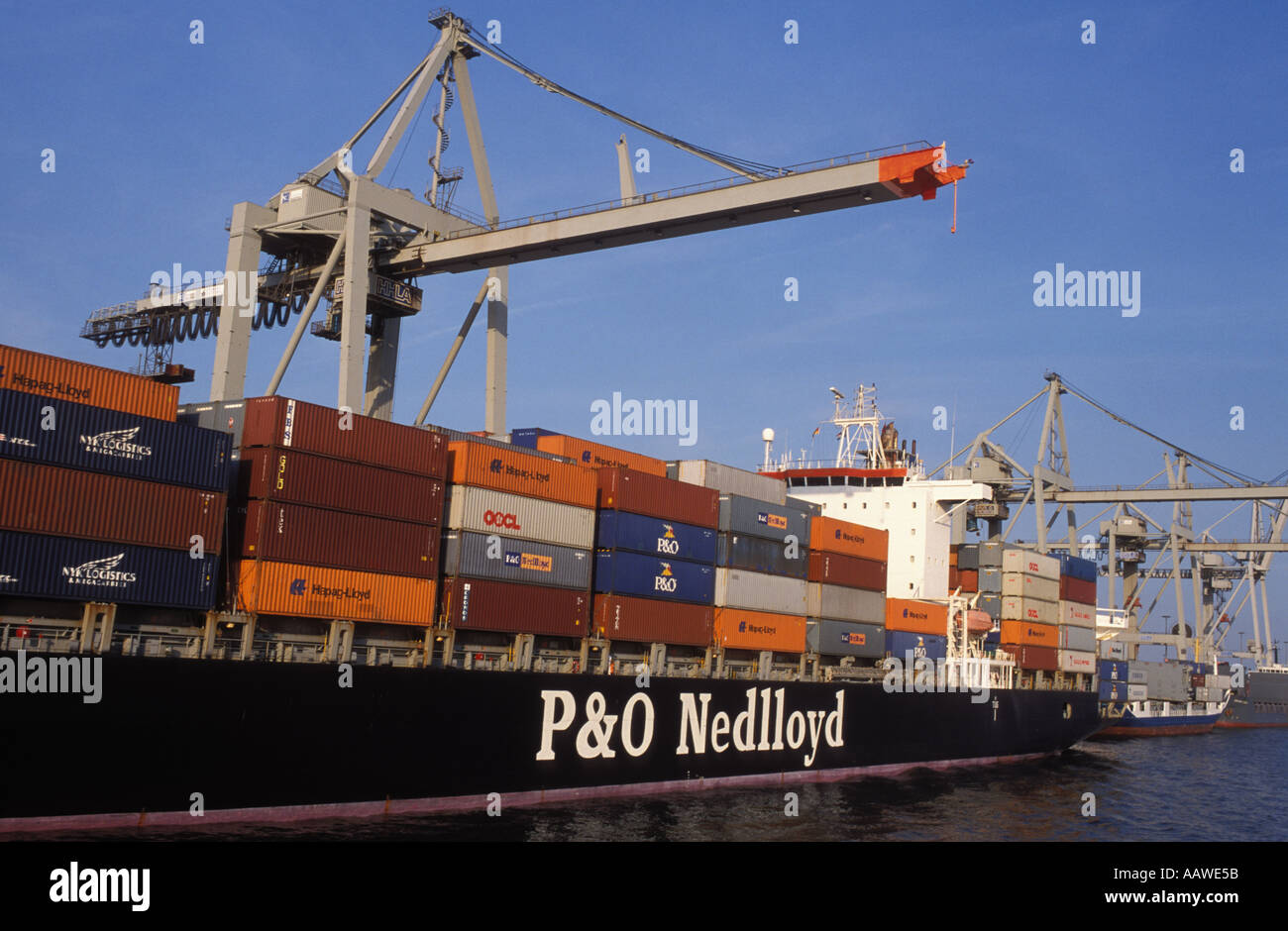 Container ship loading at the harbour, Hamburg, Germany Stock Photo