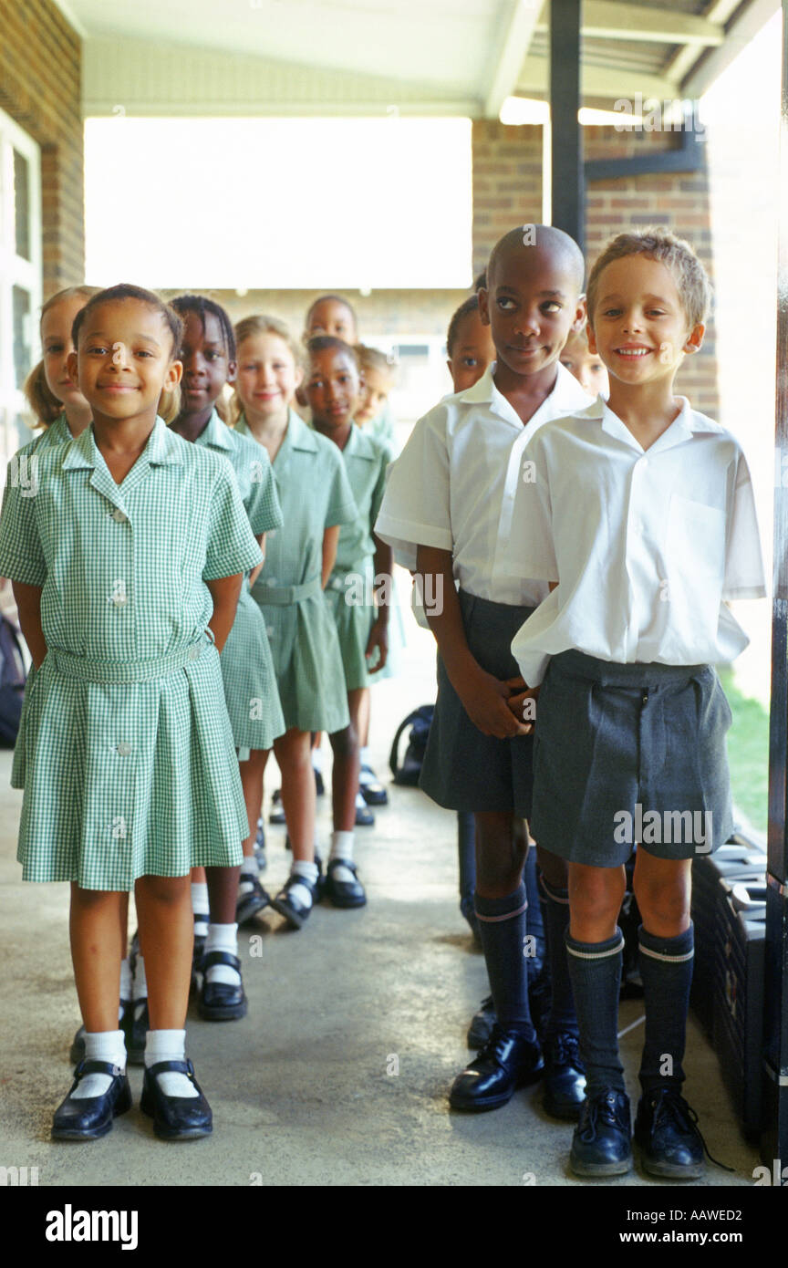 School children lining up outside classroom Johannesburg Gauteng Stock
