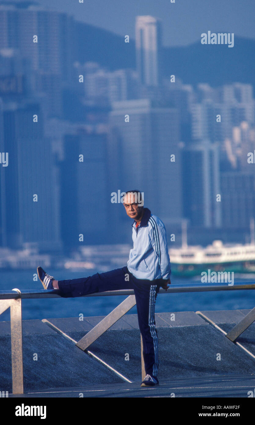 Hong Kong Man doing Tai Chi Chuan exercises Kowloon side. Hong Kong