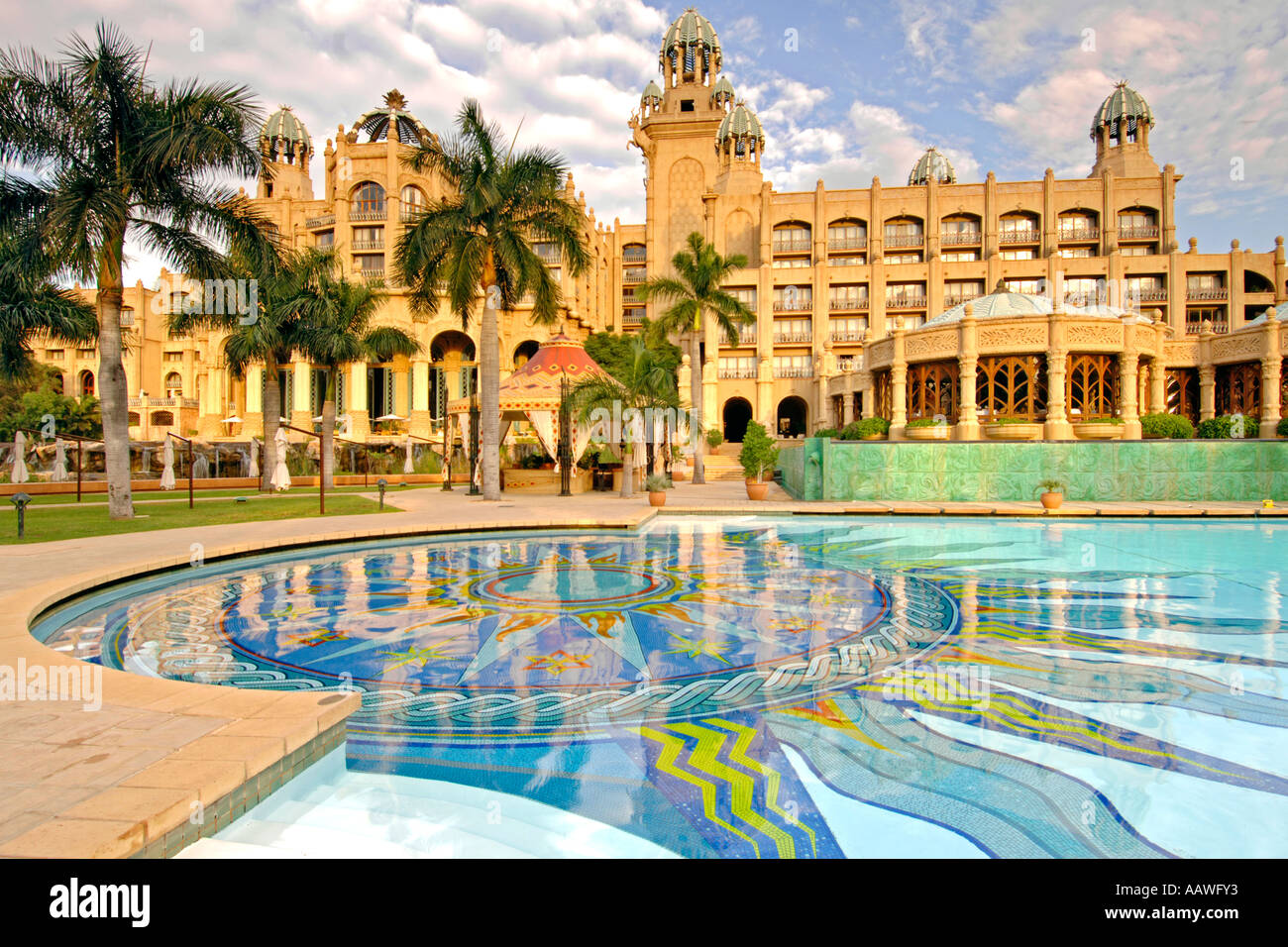 A dawn view of the Palace of the Lost City hotel and its swimming pool in the Sun City resort in South Africa. Stock Photo