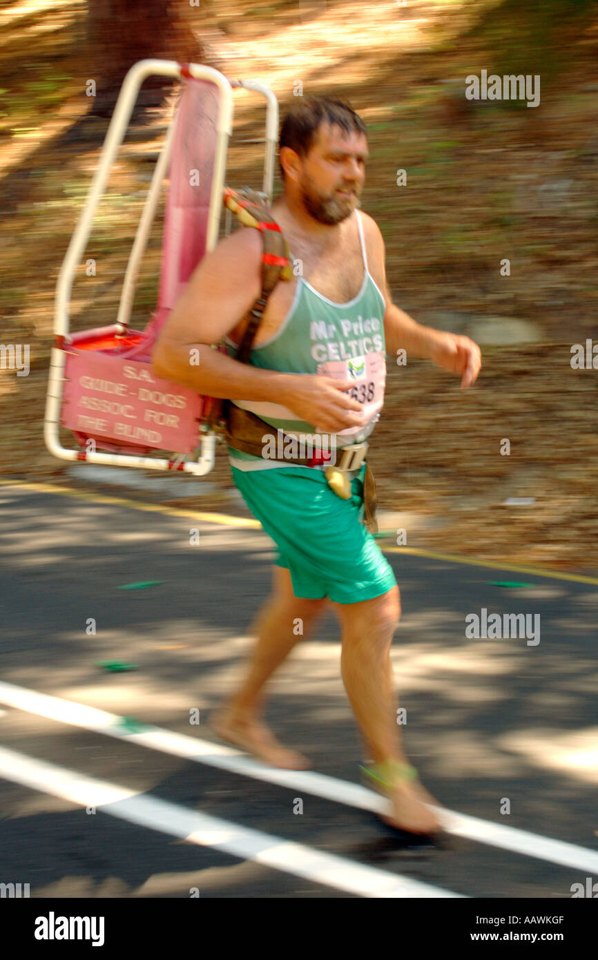 A man running the 56-kilometre, 2006 Two Oceans Marathon barefoot to raise money for guide dogs for the blind. Stock Photo