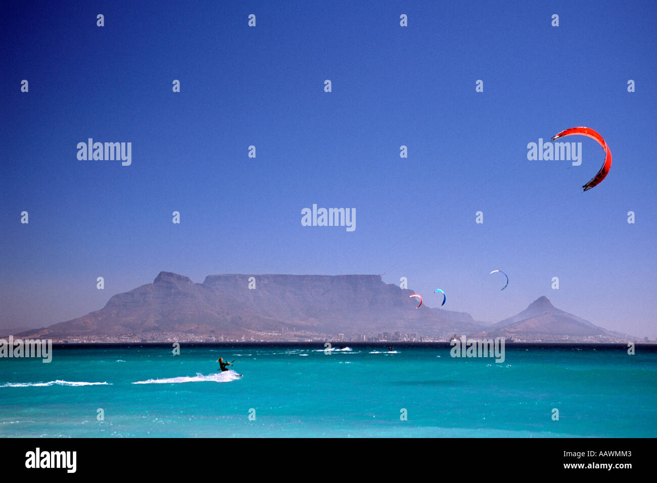 Kite surfers off Blouberg in Table Bay with Table Mountain and the city of Cape Town in the background. Stock Photo