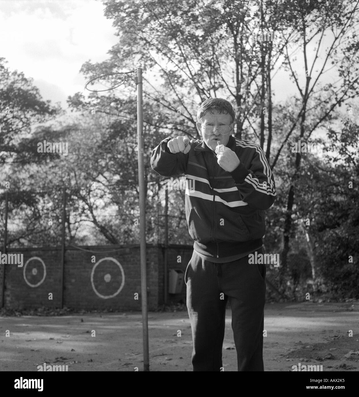 a sports teacher blowing a whistle POSED BY MODEL Stock Photo