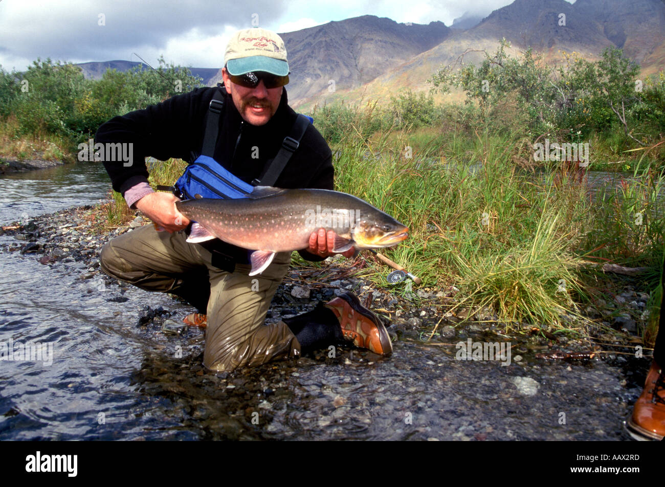 PF-249 FISHERMAN WITH LARGE ARCTIC CHAR Stock Photo - Alamy