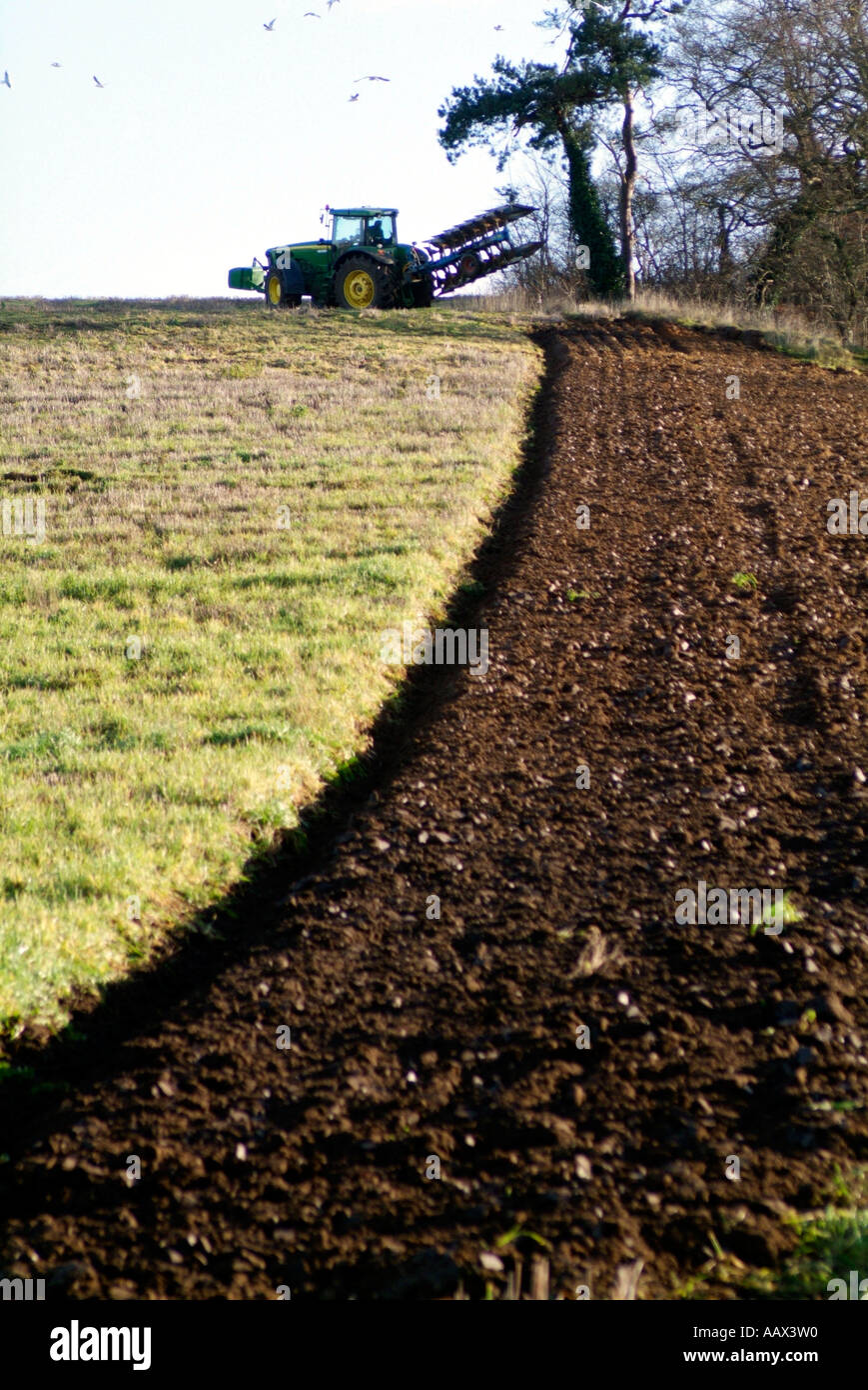 Portrait picture of tractor turning at end of ploughing run Stock Photo