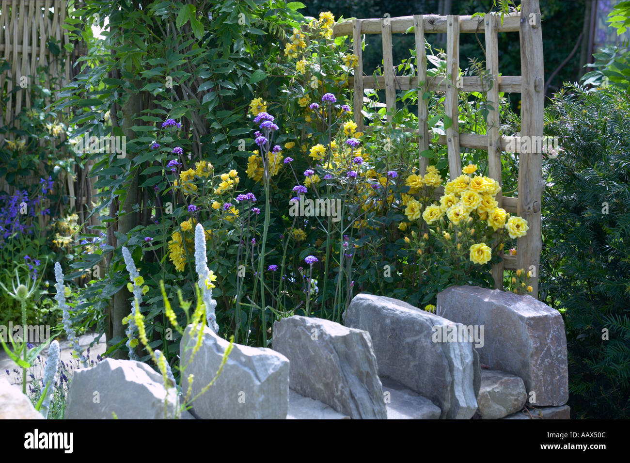 Dry Stone Drystone Wall Bounding Edge Of Garden With Trellis And Stock Photo Alamy