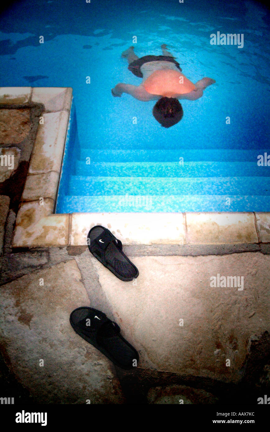 boy floating face down in swimming pool Stock Photo Alamy