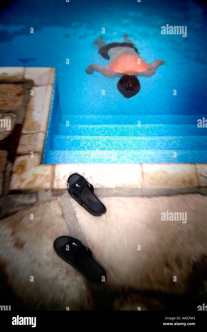 boy floating face down in swimming pool Stock Photo Alamy