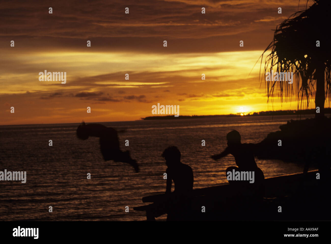 Kids playing sunset in the Marshall Islands Stock Photo