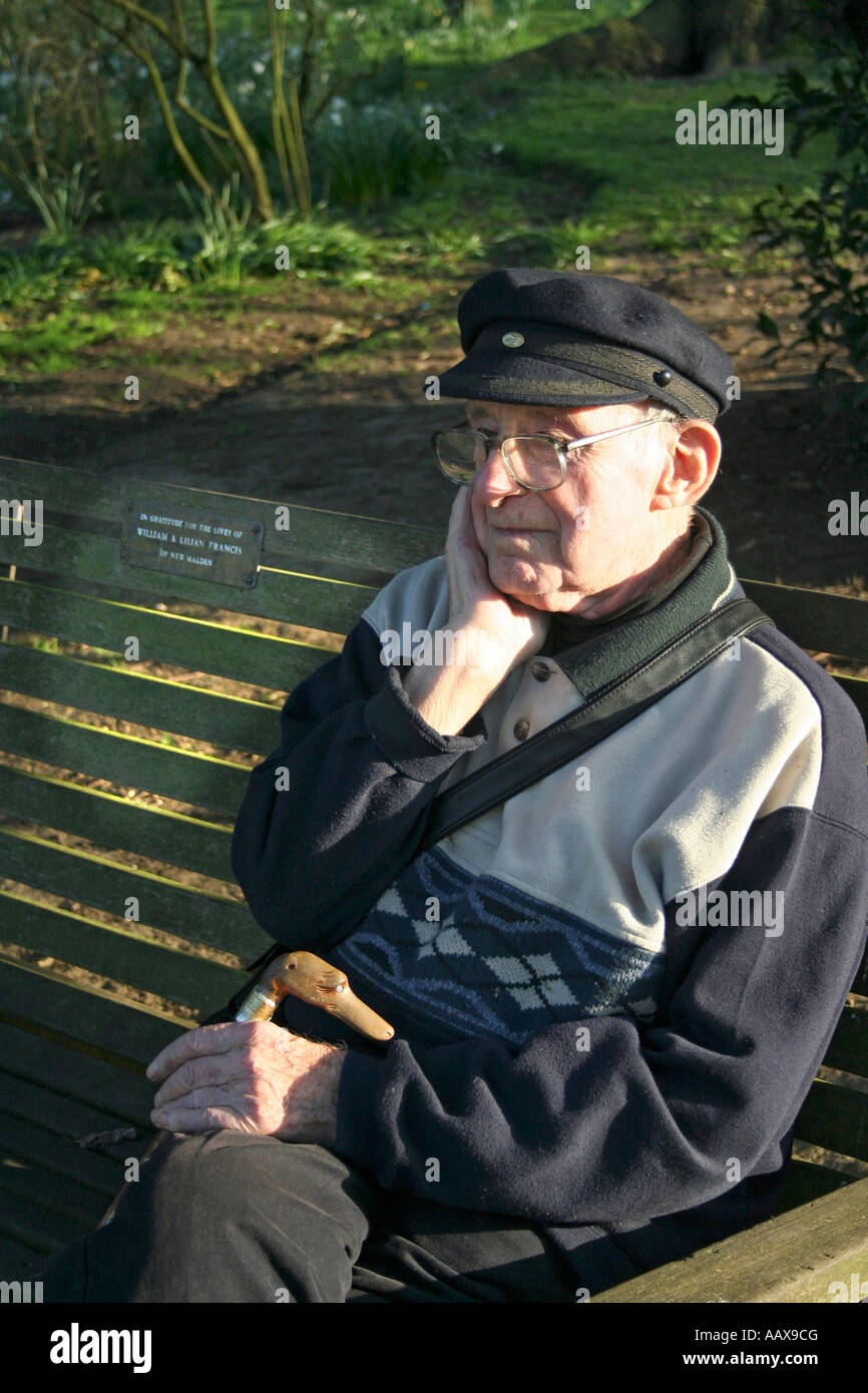 loney old man resting on a bench Stock Photo