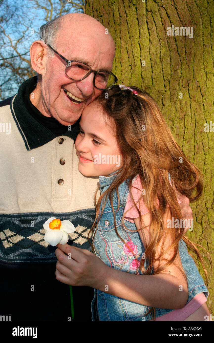 loving hug with grandad Stock Photo