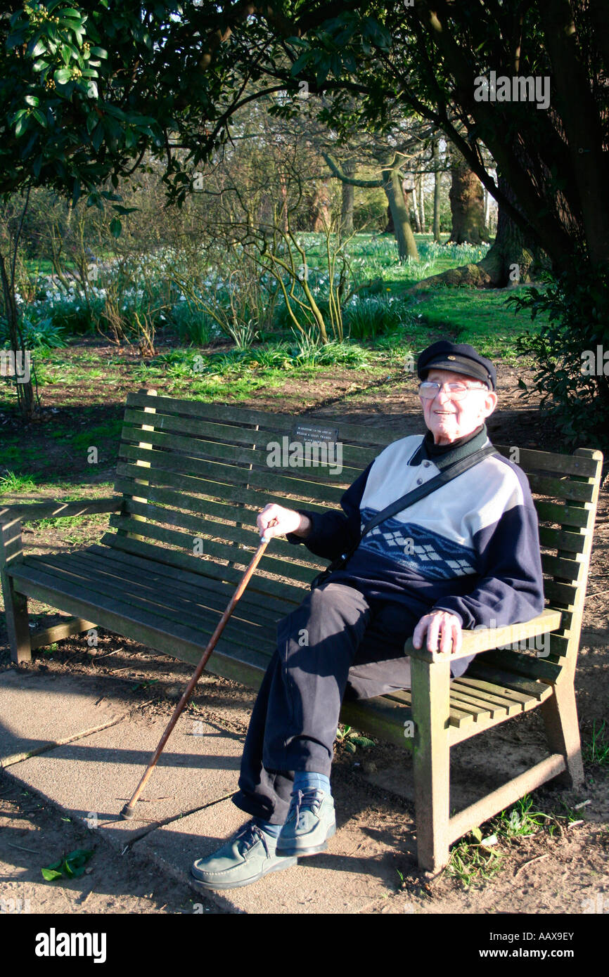 happy old man enjoying the day sitting on a bench Stock Photo - Alamy