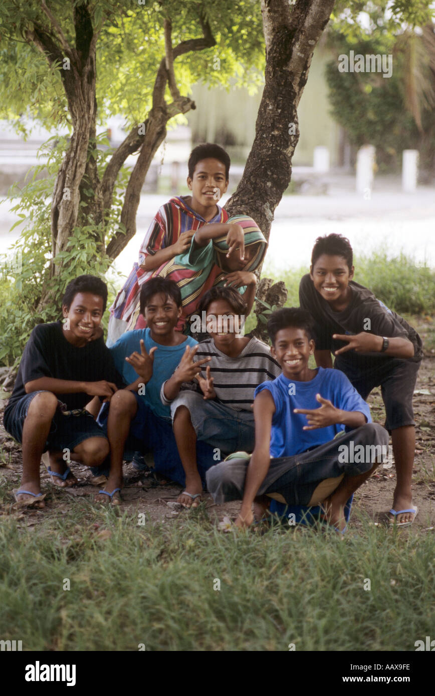 Marshall Islands Kids making American style gangster signs Stock Photo