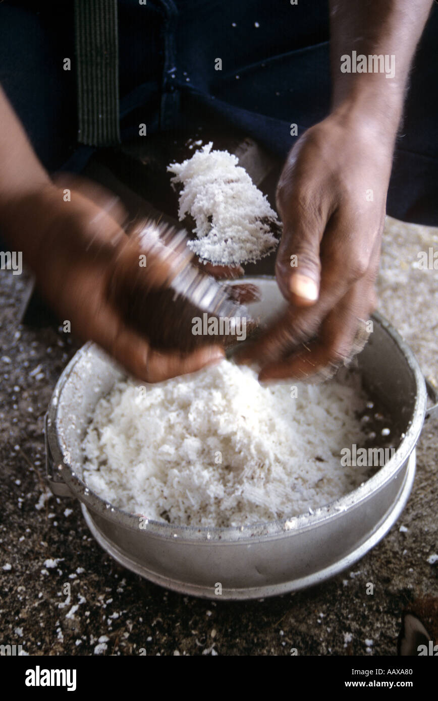 worker making copra from coconut flesh Stock Photo