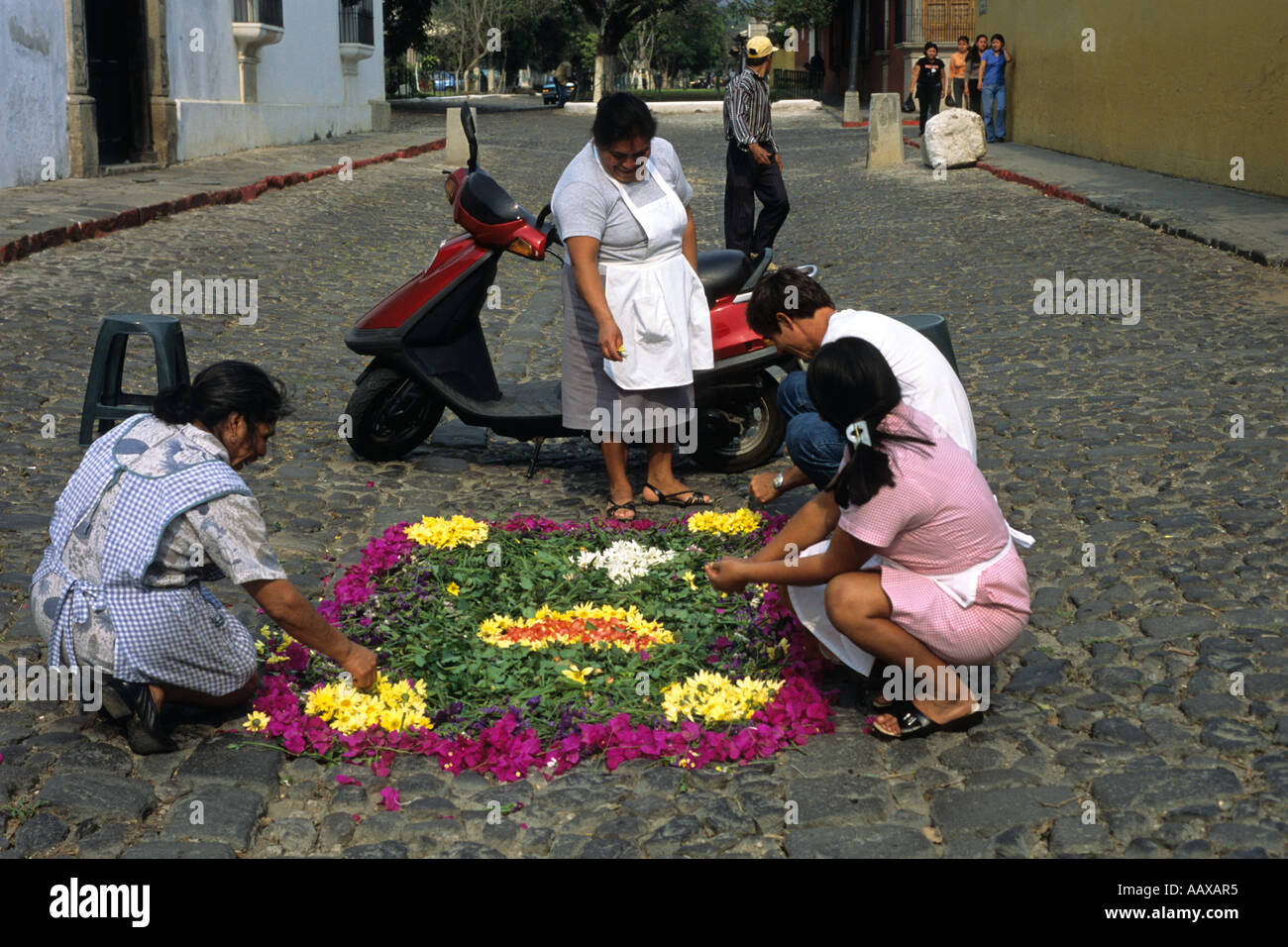 Locals preparing floral carpets before the Holy week procession in Antigua city Guatemala Stock Photo