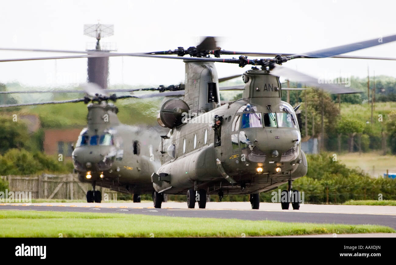 Two Royal Air Force Chinook HC2 heavy lift cargo helicopters serials ZA705 and ZA683 at RAF Waddington. Stock Photo
