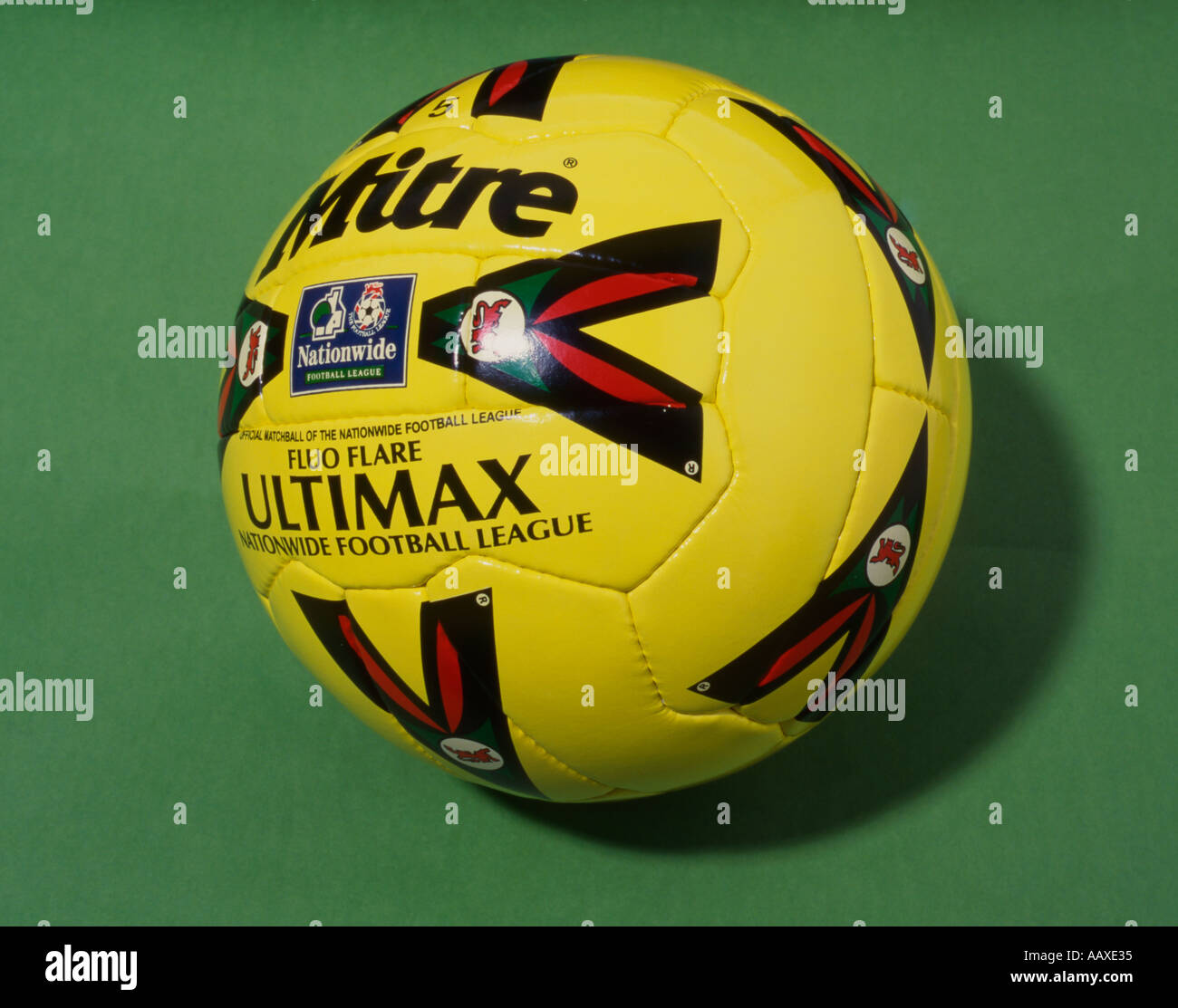 stitched Mitre football on green background Stock Photo