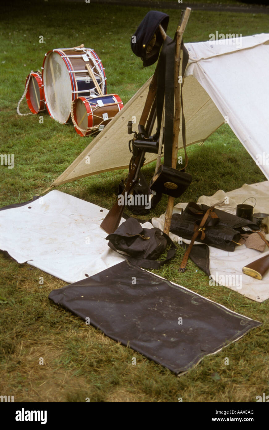 Civil war reenactors encampment drums canvas tent stacked rifles