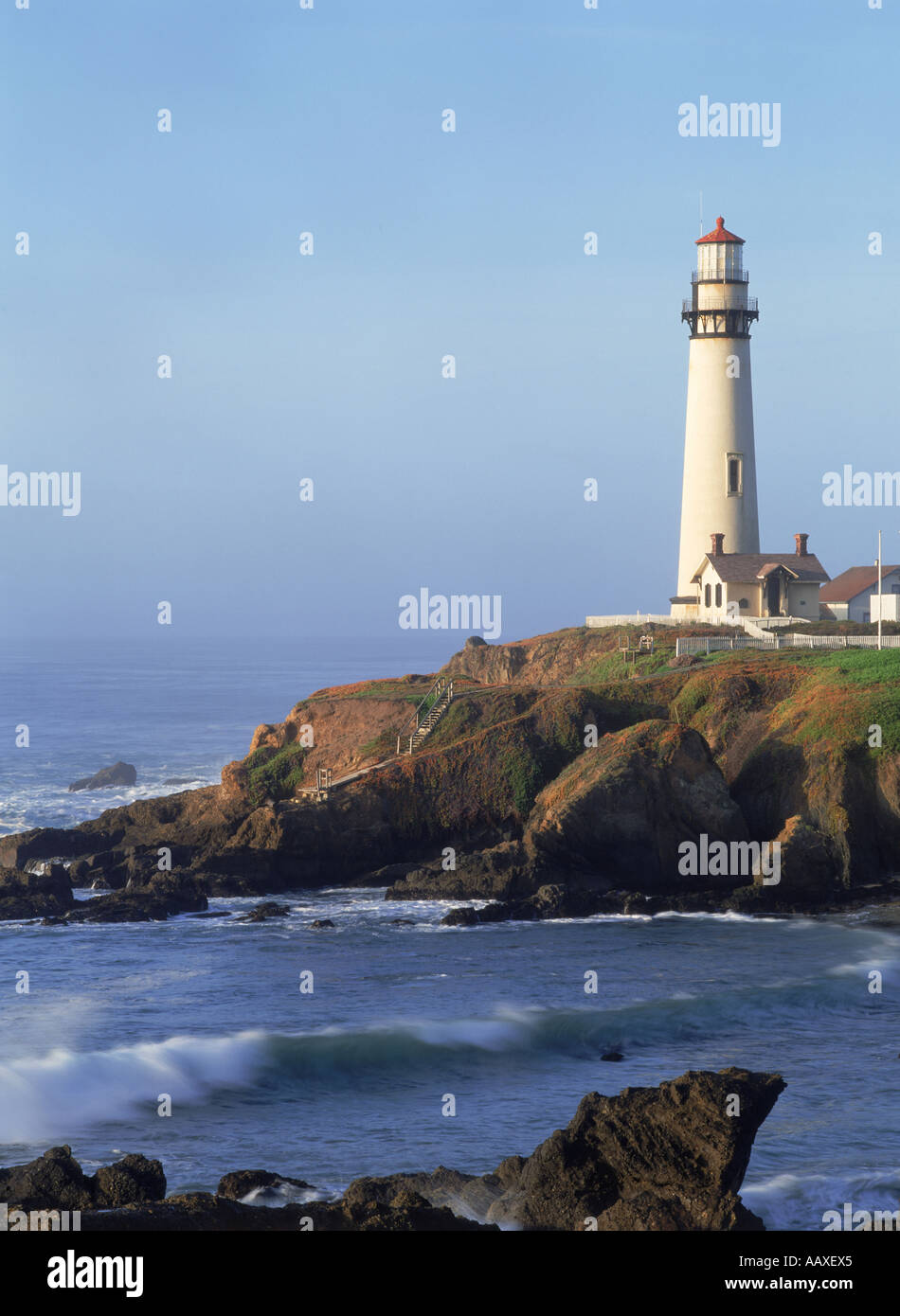 Pigeon Point Lighthouse on rocky bluff near Pescadero California Stock Photo