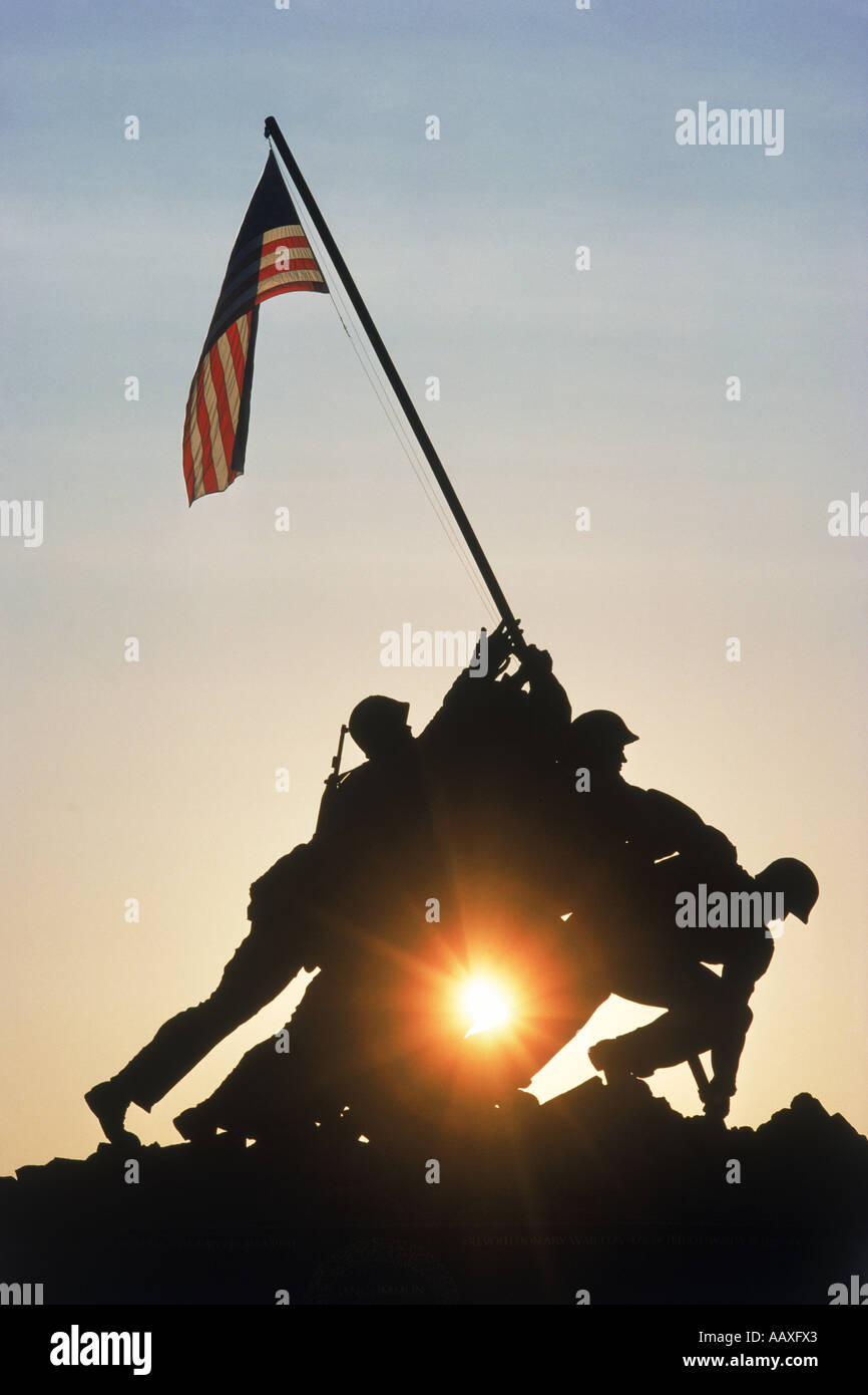 US Marine Corps War Memorial silhouetted in Arlington National Cemetery at sunrise Stock Photo