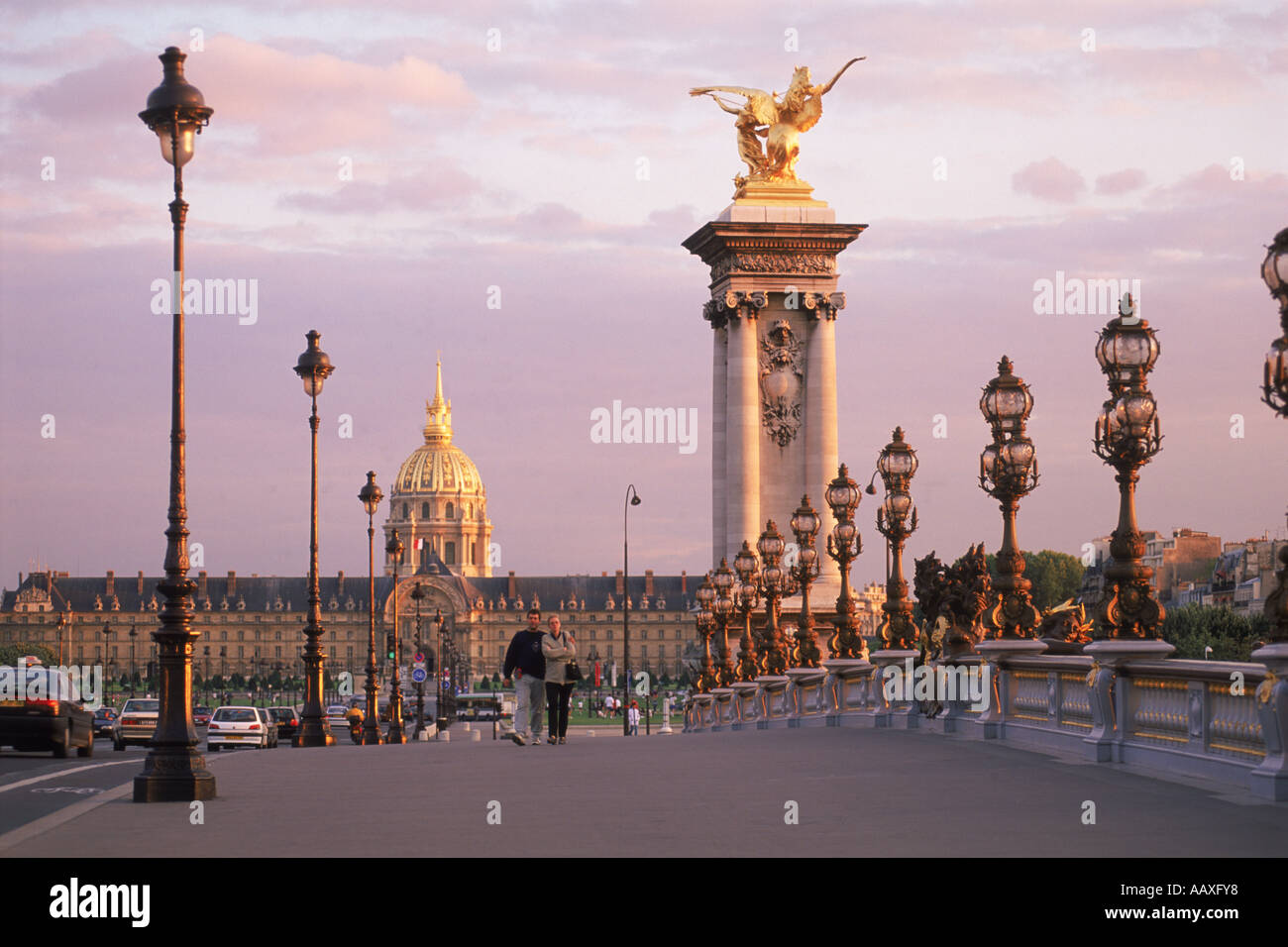 Pont Alexandre III and Hotel des Invalides at sunset in Paris Stock ...
